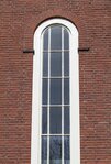 Hoog rondboogvenster aan de Insulindeweg.
<br/>
Marcel Westhoff, 2018-04-01
